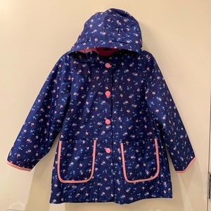 Carter’s size 5/6, polyester lined rain coat, floral print, snap up with pockets